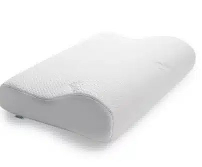 Oreiller ergonomique blanc en mousse à mémoire de forme avec surface texturée alvéolée et contours ondulés, bord gris clair.